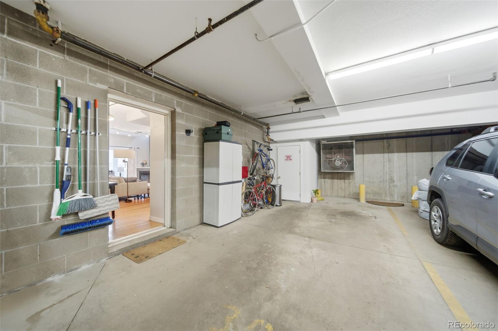 3045 Umatilla Street Denver, CO 80211 - Photo 31 of 48 a view of a livingroom with furniture and a garage