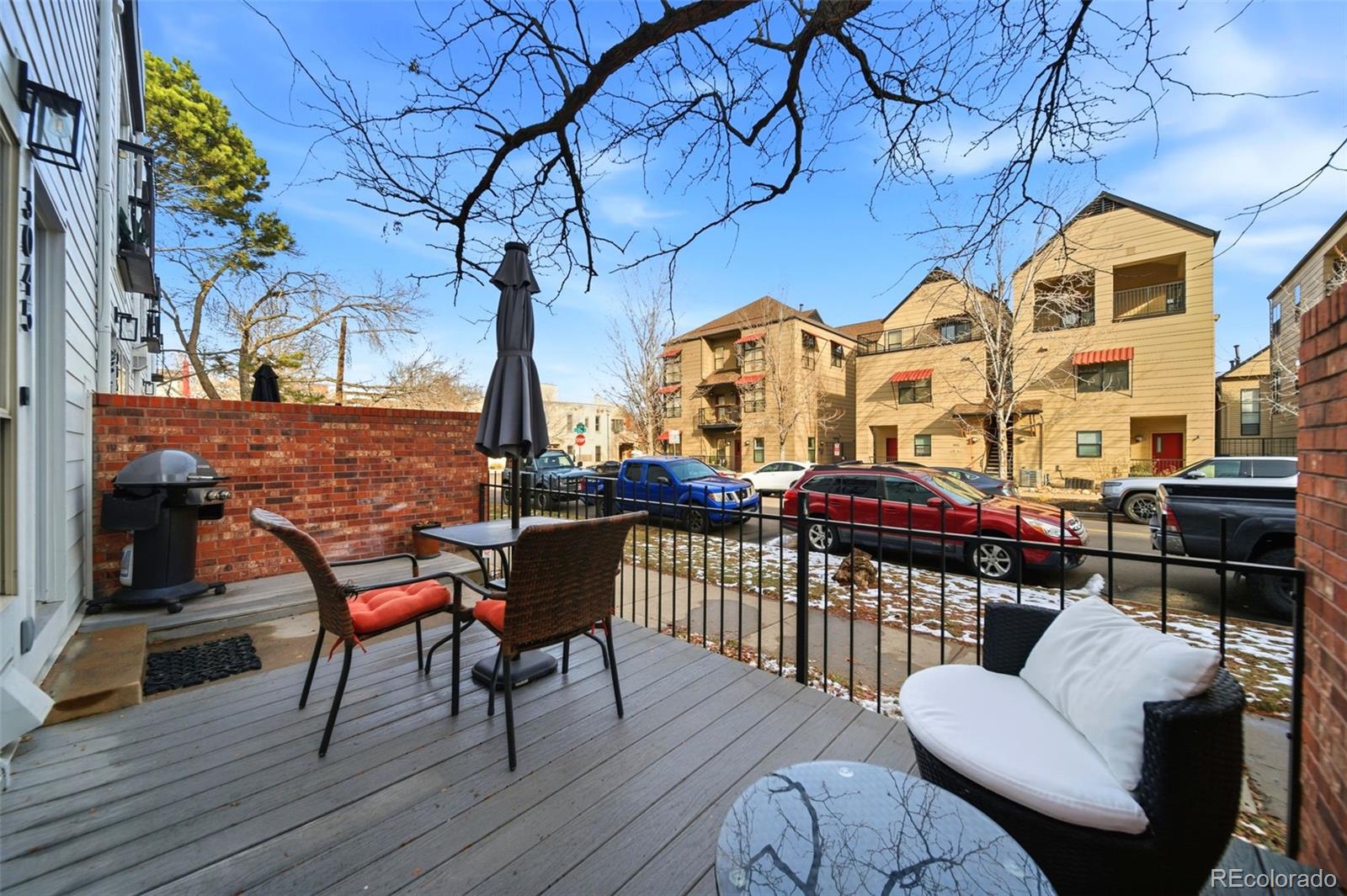3045 Umatilla Street Denver, CO 80211 - Photo 32 of 48 a view of a chairs and table on the deck
