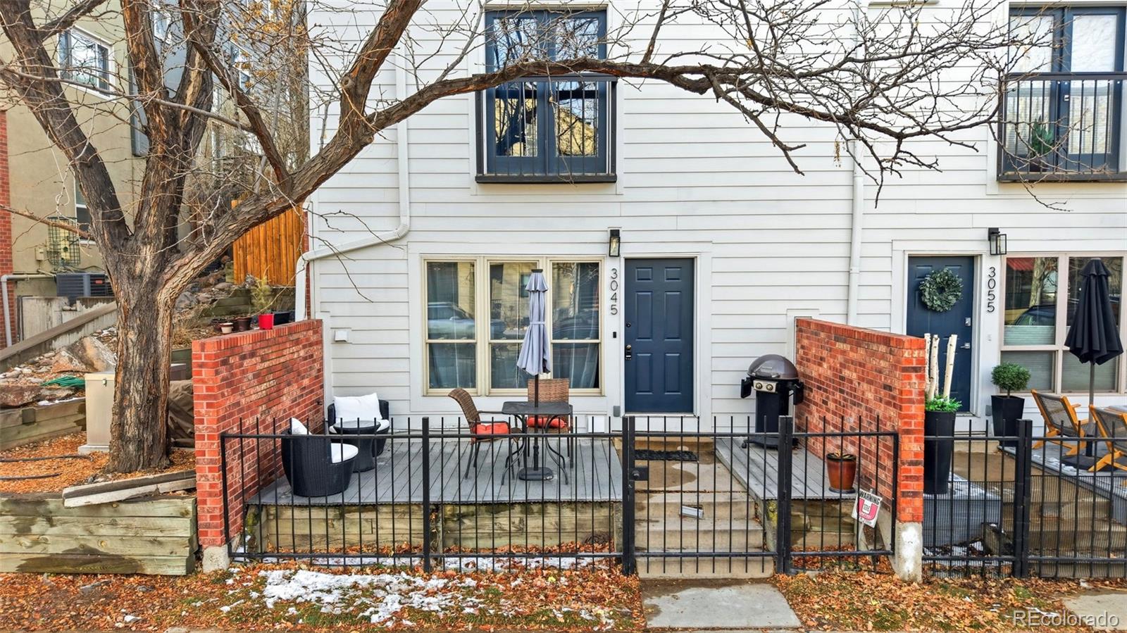 3045 Umatilla Street Denver, CO 80211 - Photo 34 of 48 a view of a patio with couches table and chairs and potted plants