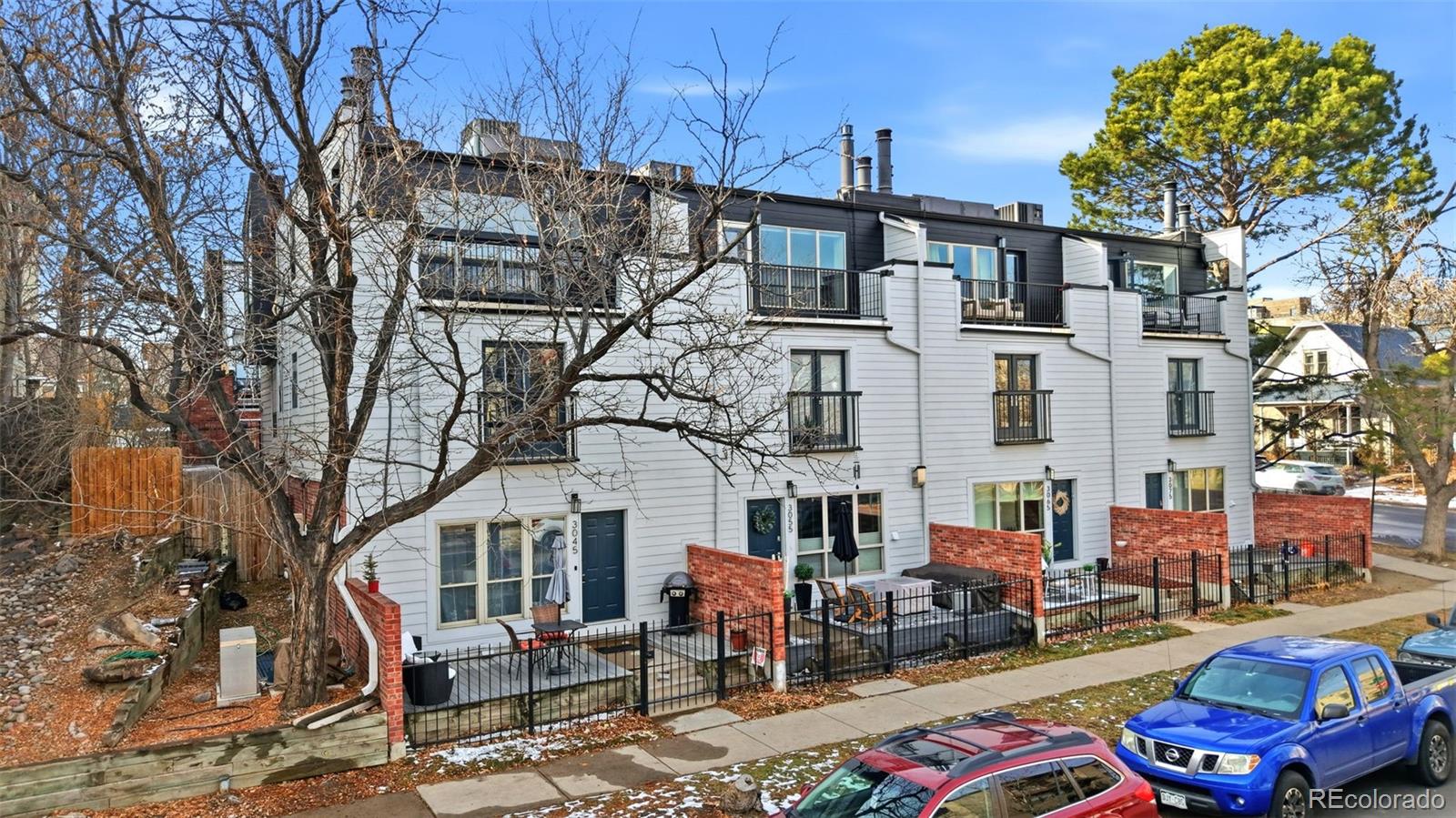 3045 Umatilla Street Denver, CO 80211 - Photo 42 of 48 a car park in front of a brick building
