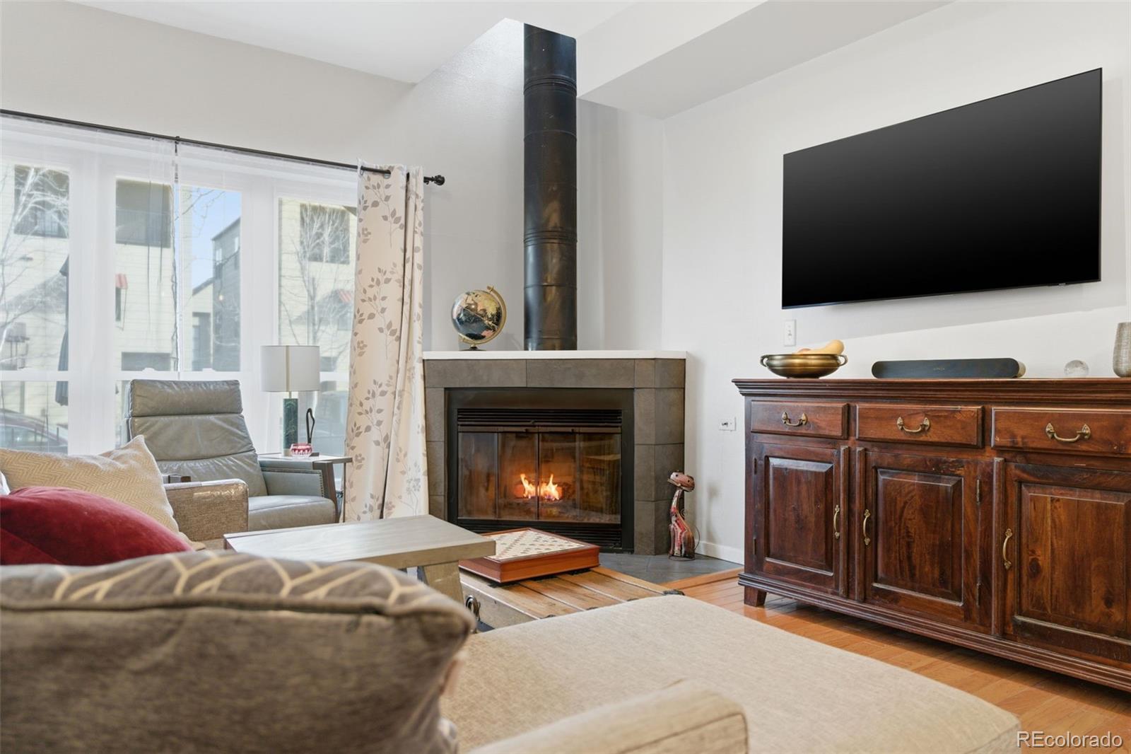 3045 Umatilla Street Denver, CO 80211 - Photo 5 of 48 a living room with furniture and a fireplace