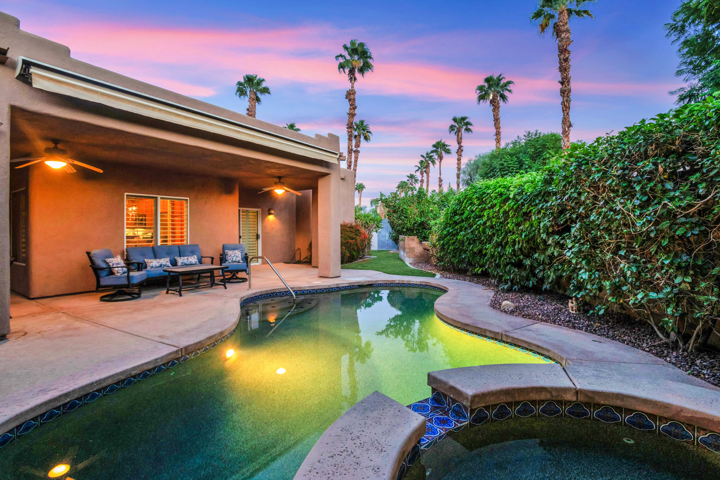 35691 Felicity Place Cathedral City, CA 92234 - Photo 1 of 48 a view of a swimming pool with a lounge chairs in front of house