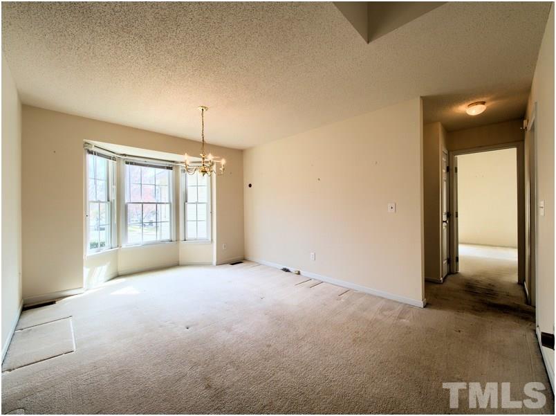 9513 Cub Trail Raleigh, NC 27615 - Photo 4 of 8 a view of an empty room with a window