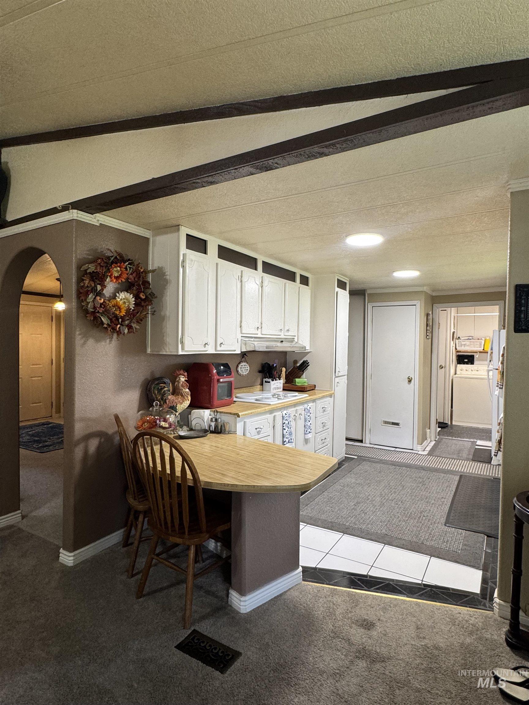 1200 Artesian Road, Unit 36 Eagle, ID 83616 - Photo 4 of 13 Kitchen with white cabinetry, wood-finish countertop, and recessed lighting