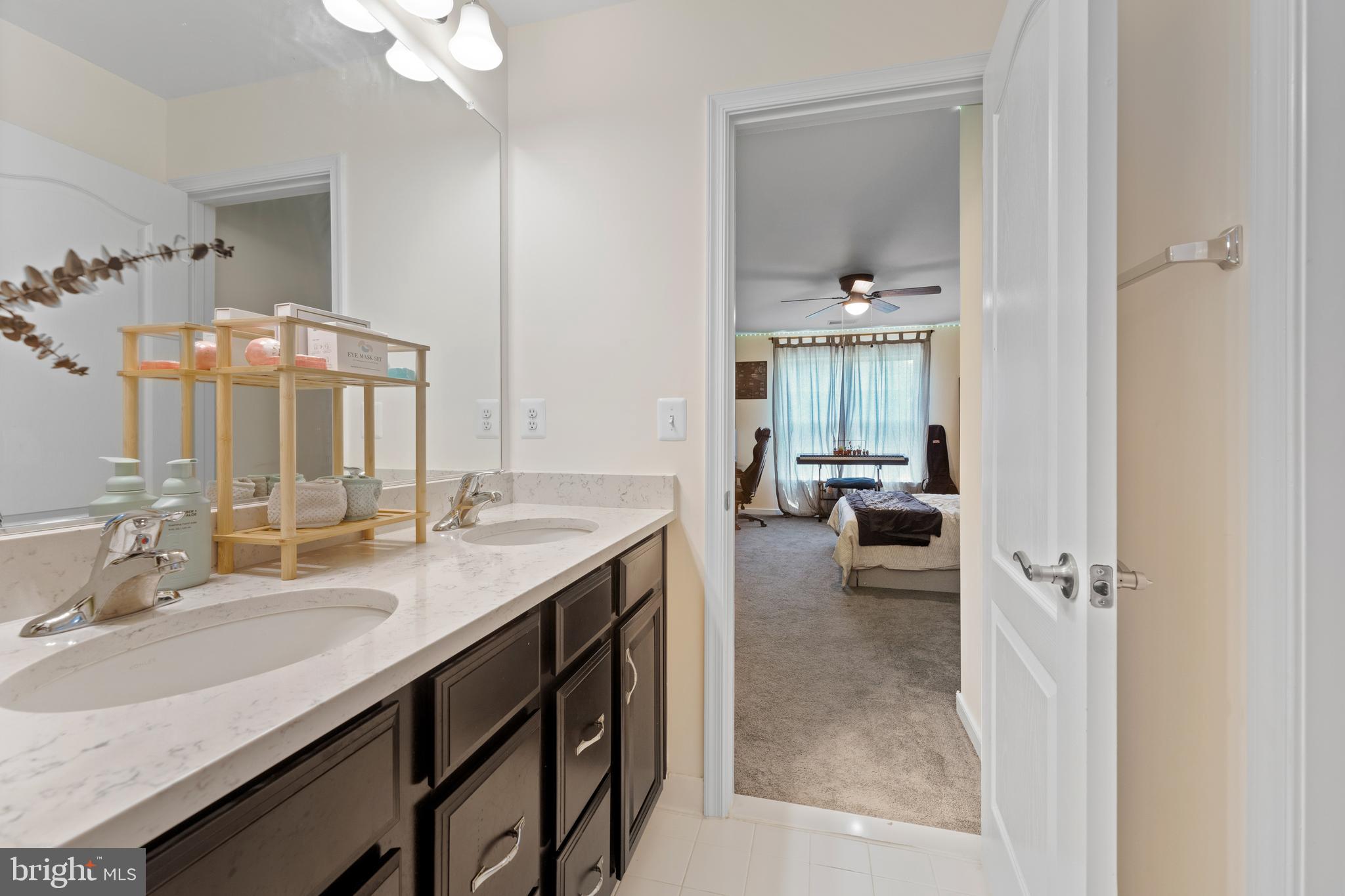 80 Shackelford Well Road Fredericksburg, VA 22406 - Photo 56 of 108 a en suite bathroom with a granite countertop sink a mirror and a