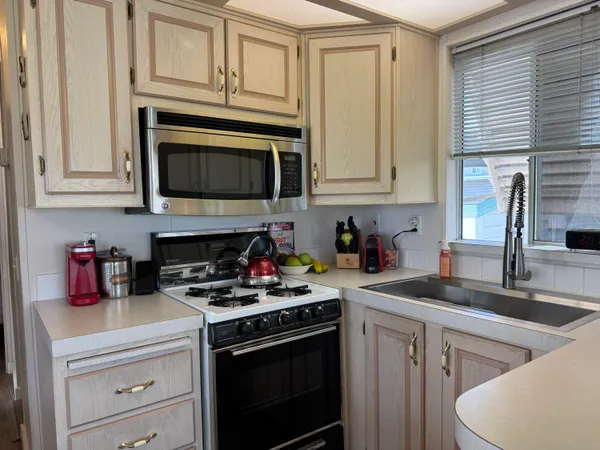 a view of living room with furniture and a fireplace