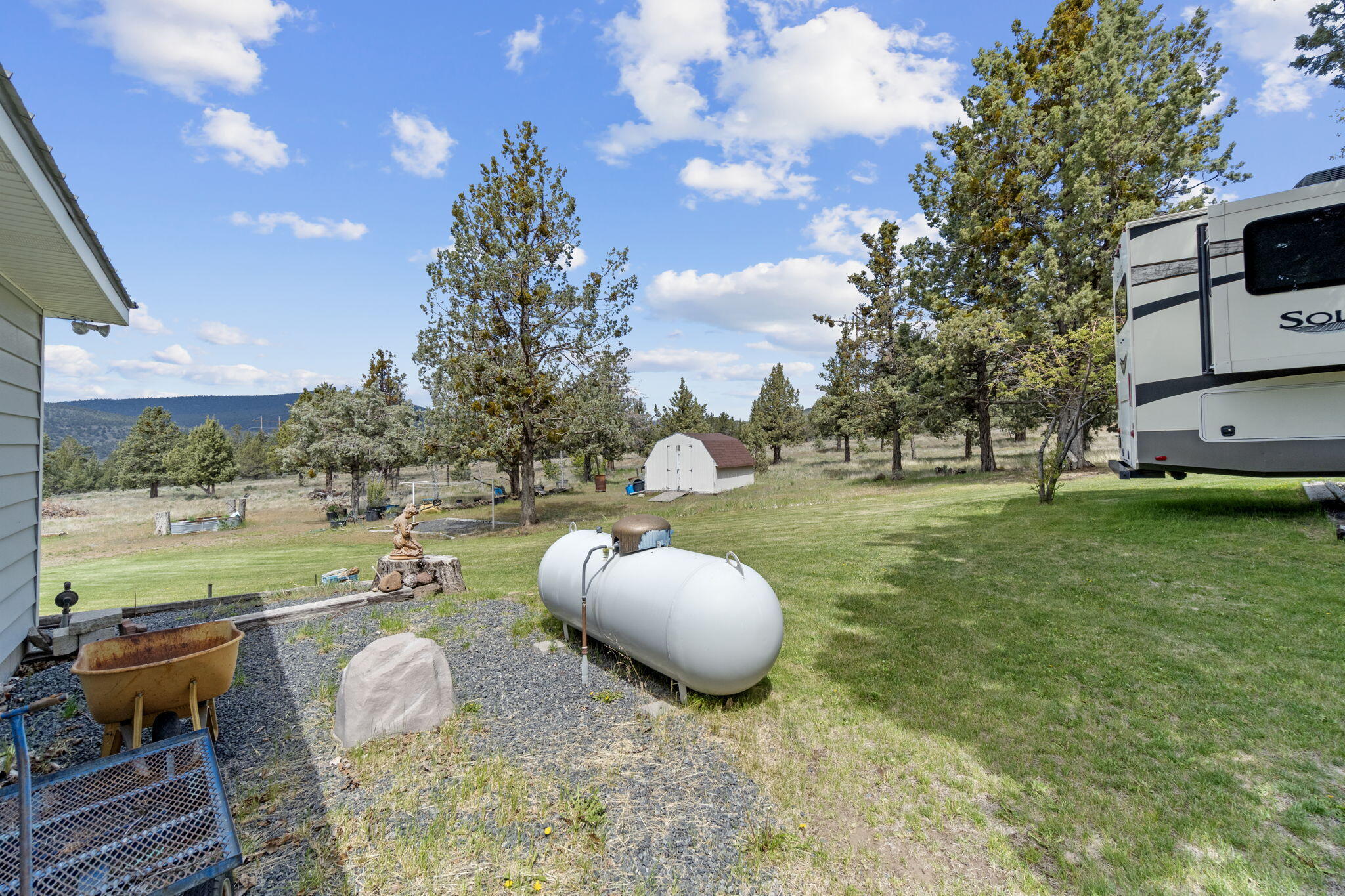 17722 Pope Road Merrill, OR 97633 - Photo 58 of 61 a backyard of a house with table and chairs