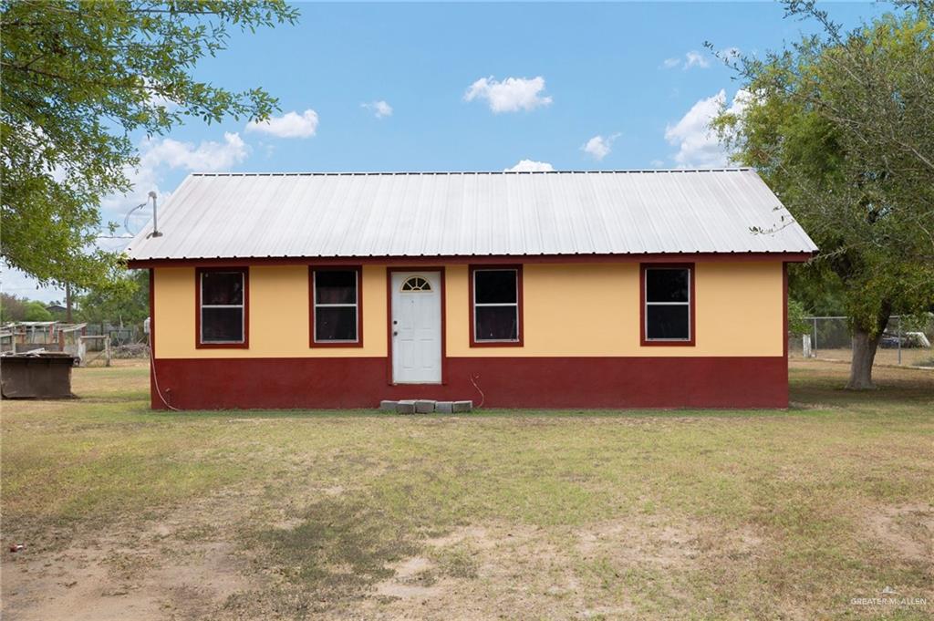 13615 Miraflores Street Edcouch, TX 78538 - Photo 1 of 13 Ranch-style house with a metal roof and stucco siding