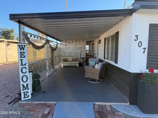 a roof deck view with a table and chairs