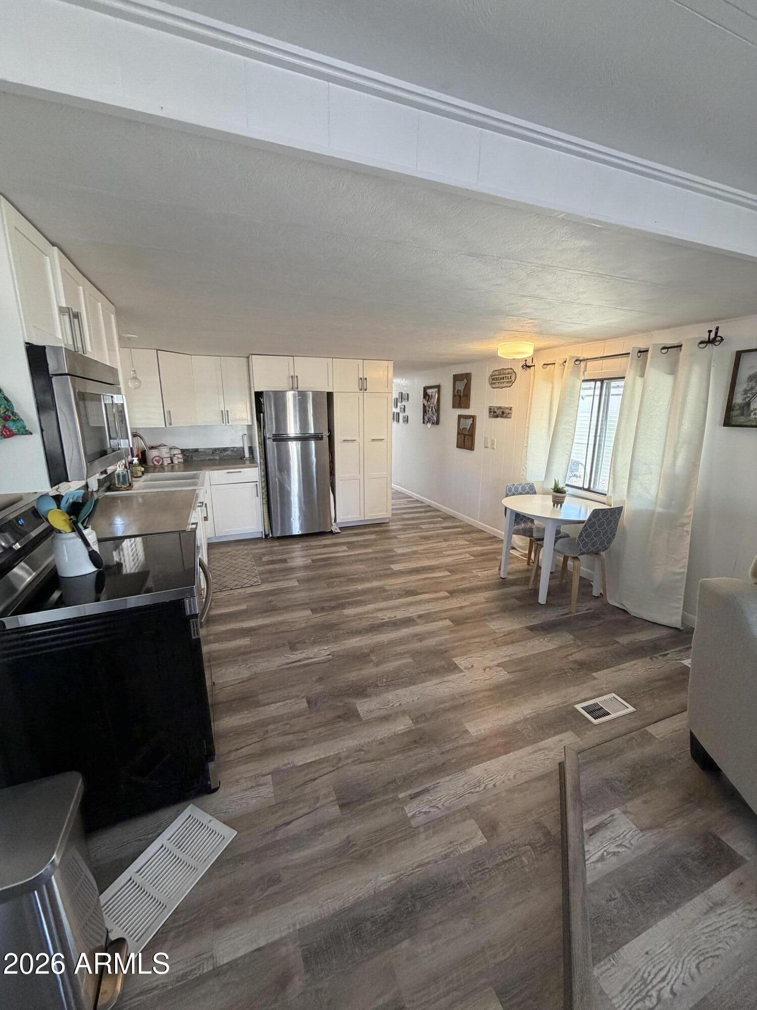 3104 East Broadway Road North, Unit 307 Mesa, AZ 85204 - Photo 5 of 11 a living room with furniture