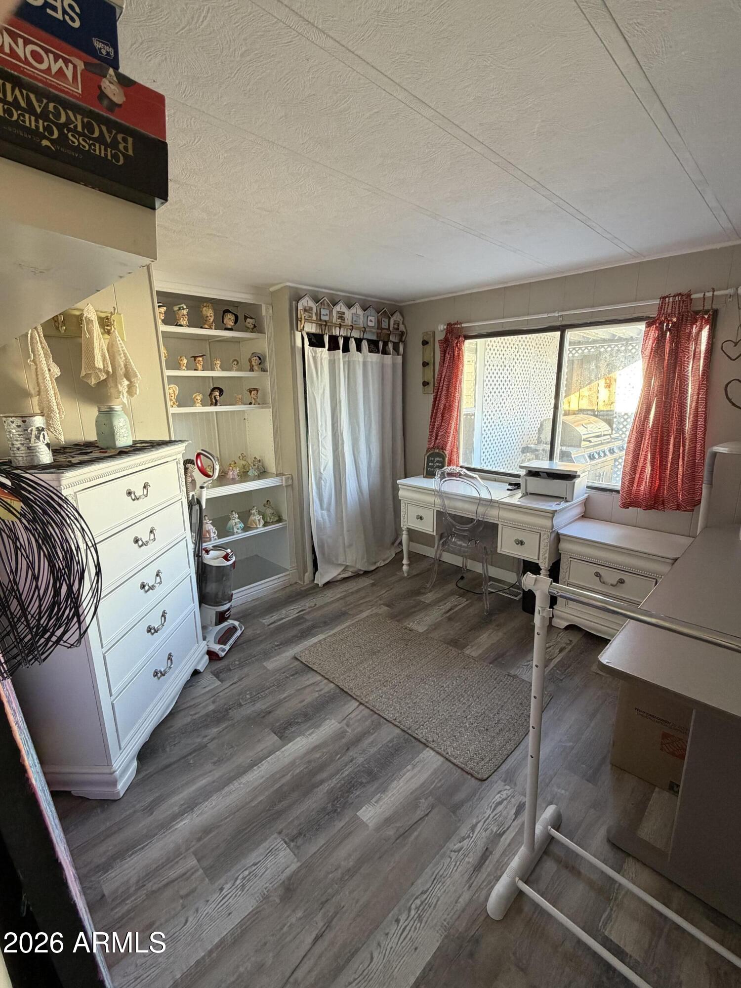 3104 East Broadway Road North, Unit 307 Mesa, AZ 85204 - Photo 9 of 11 a bedroom with furniture and a window