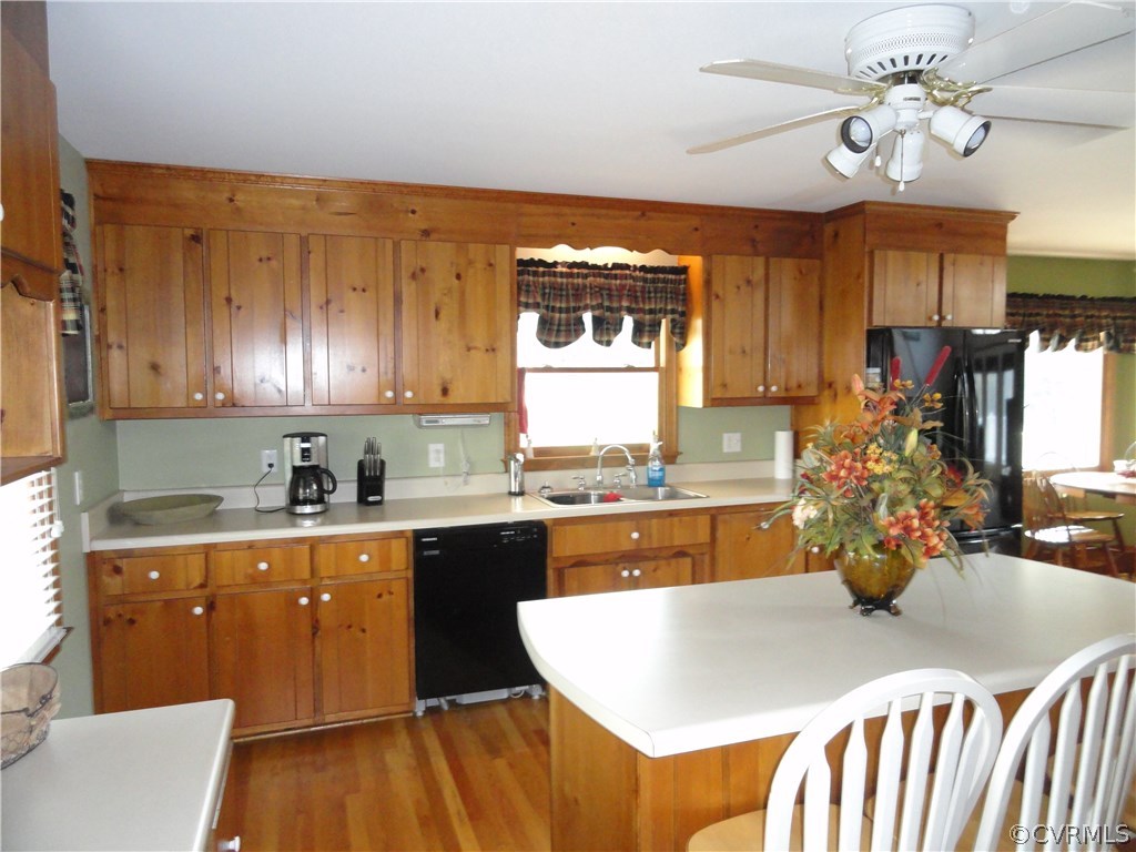 17908 Courthouse Road Dinwiddie, VA 23841 - Photo 11 of 49 a kitchen with kitchen island granite countertop a sink cabinets and stainless steel appliances