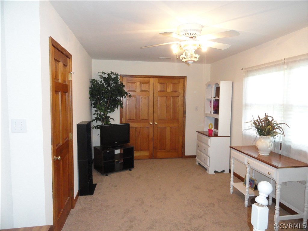 17908 Courthouse Road Dinwiddie, VA 23841 - Photo 20 of 49 a living room with furniture and a chandelier