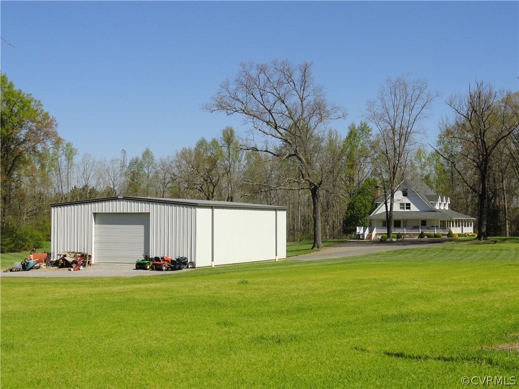 17908 Courthouse Road Dinwiddie, VA 23841 - Photo 29 of 49 a view of a house with a yard and sitting area