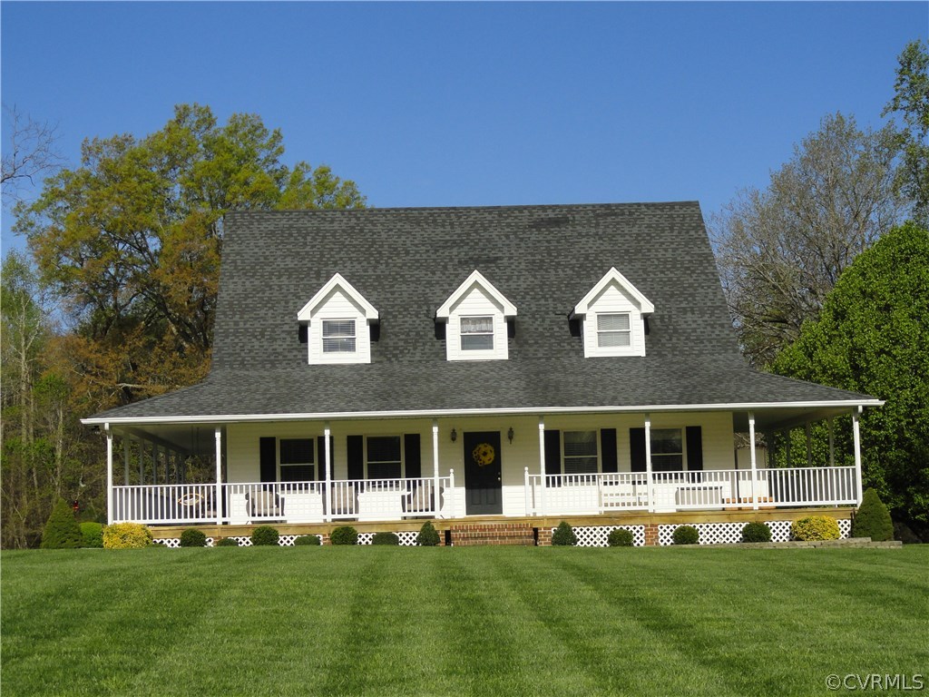 17908 Courthouse Road Dinwiddie, VA 23841 - Photo 3 of 49 a view of an house with backyard space and balcony