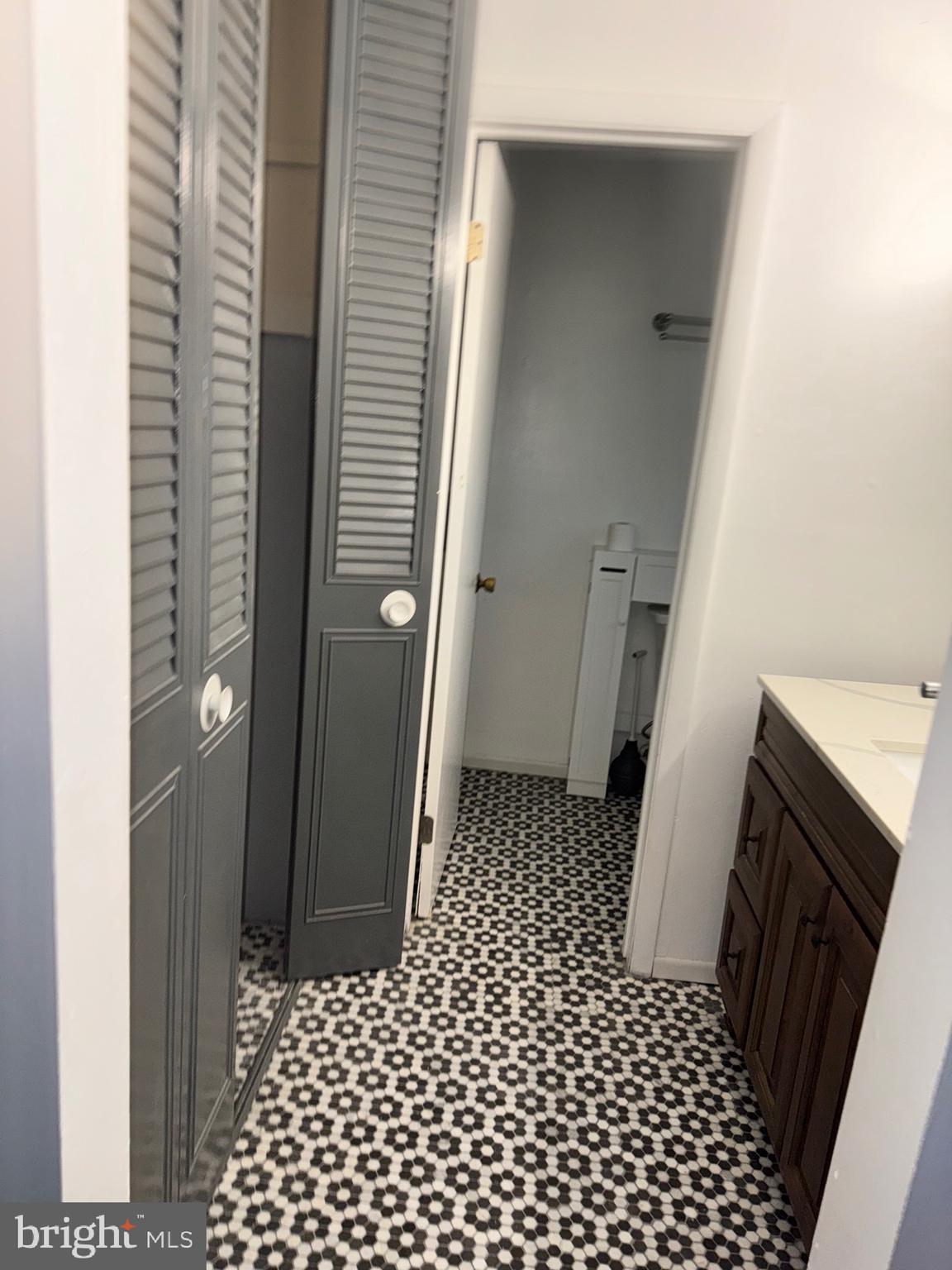 6703 Greenview Lane Springfield, VA 22152 - Photo 19 of 41 a bathroom with a sink and a shower