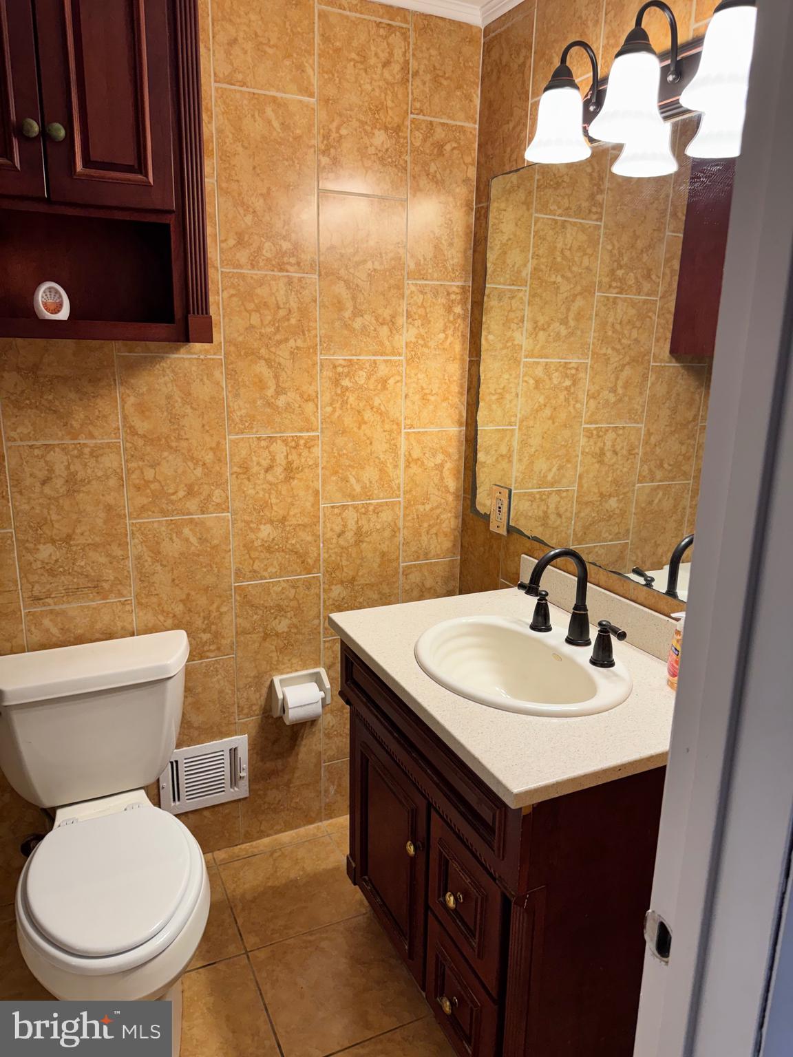 6703 Greenview Lane Springfield, VA 22152 - Photo 28 of 41 a bathroom with a sink and a toilet