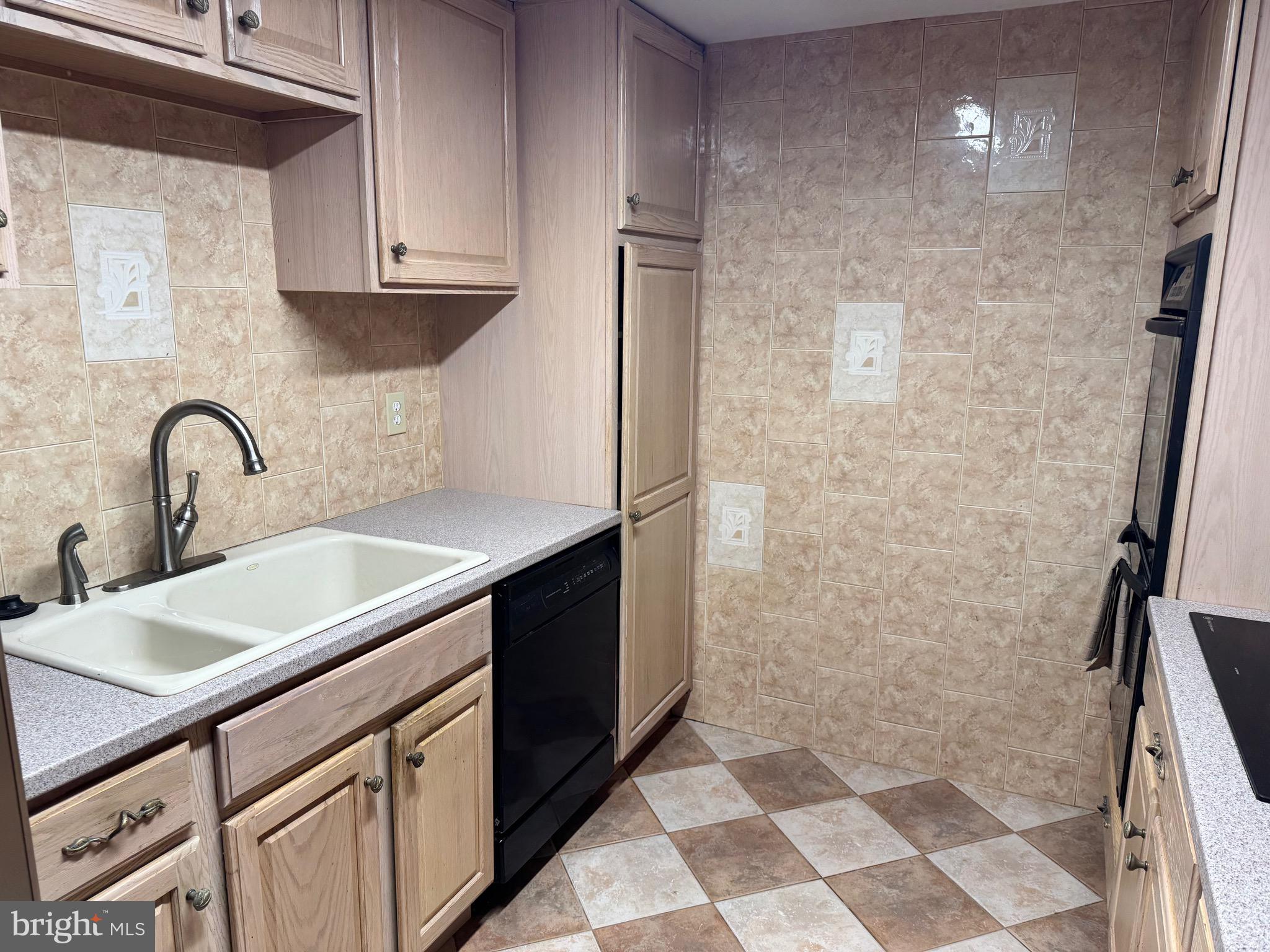6703 Greenview Lane Springfield, VA 22152 - Photo 38 of 41 a kitchen with a sink and cabinets