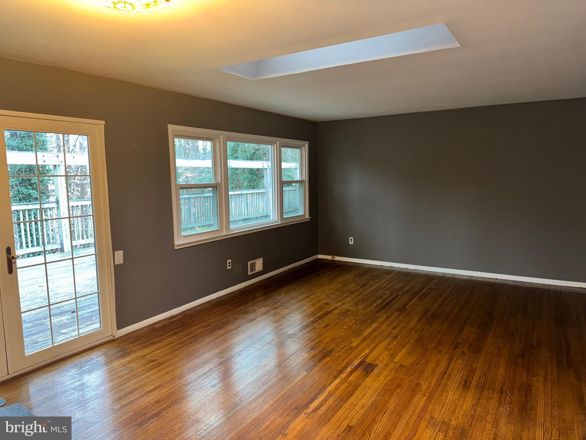 6703 Greenview Lane Springfield, VA 22152 - Photo 9 of 41 a view of an empty room with wooden floor and a window