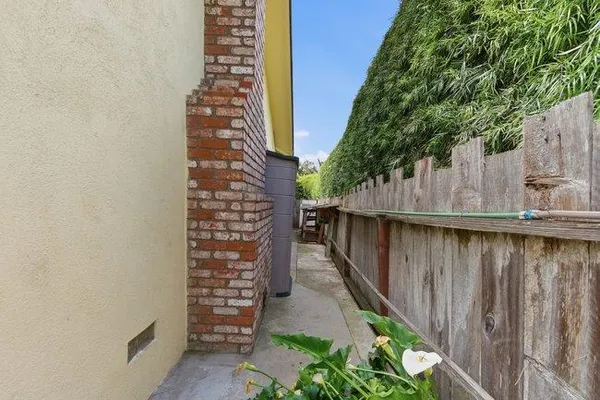 a view of balcony with furniture