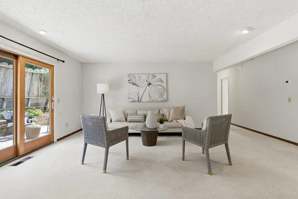 a view of a dining room with furniture window and outside view