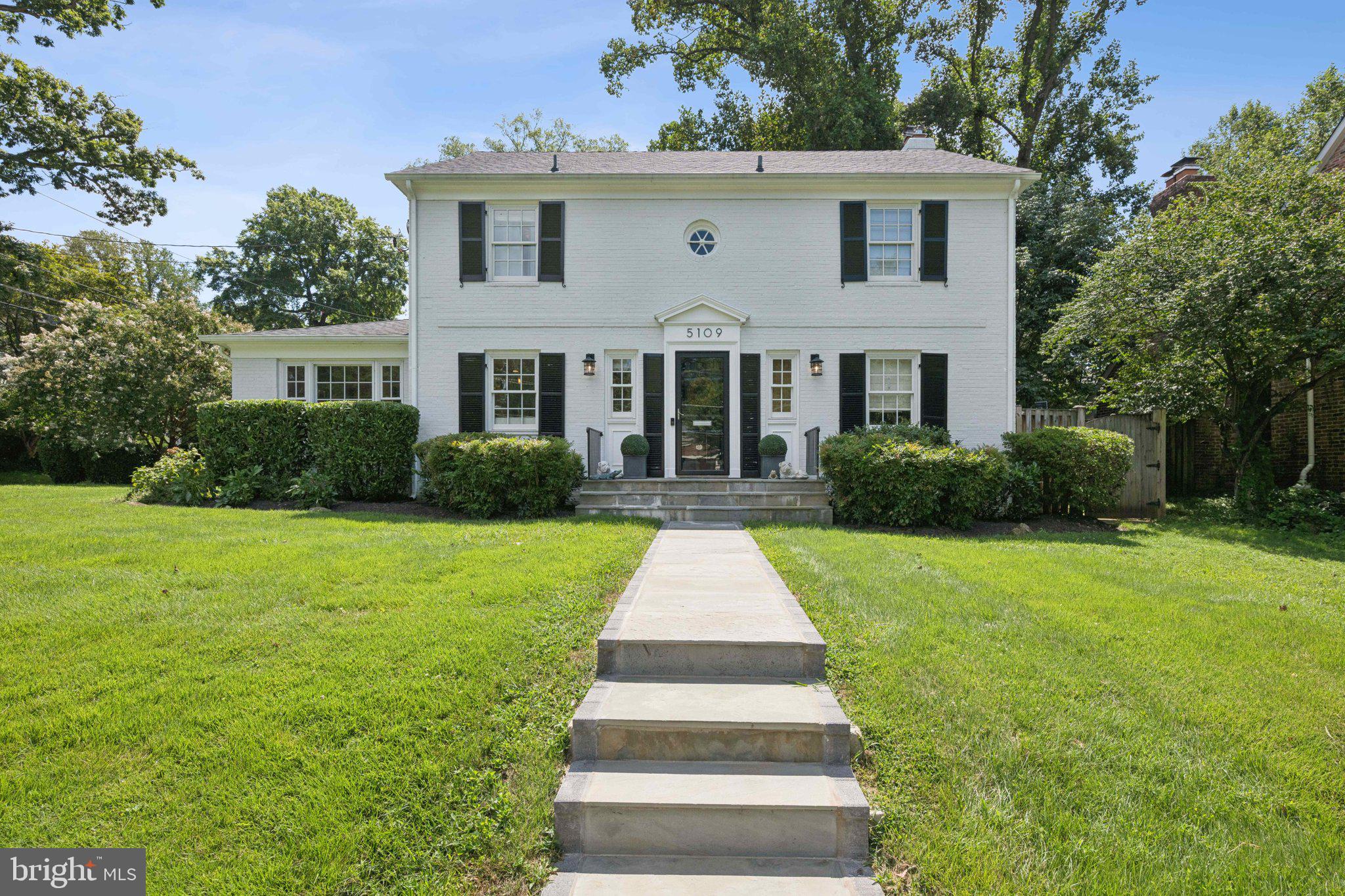 5109 River Hill Road Bethesda, MD 20816 - Photo 1 of 21 a front view of a house with garden