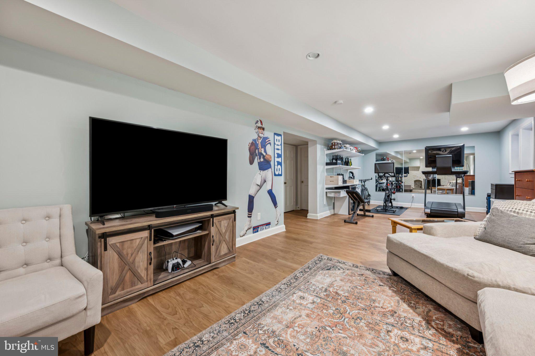 5109 River Hill Road Bethesda, MD 20816 - Photo 16 of 21 a living room with furniture and a flat screen tv