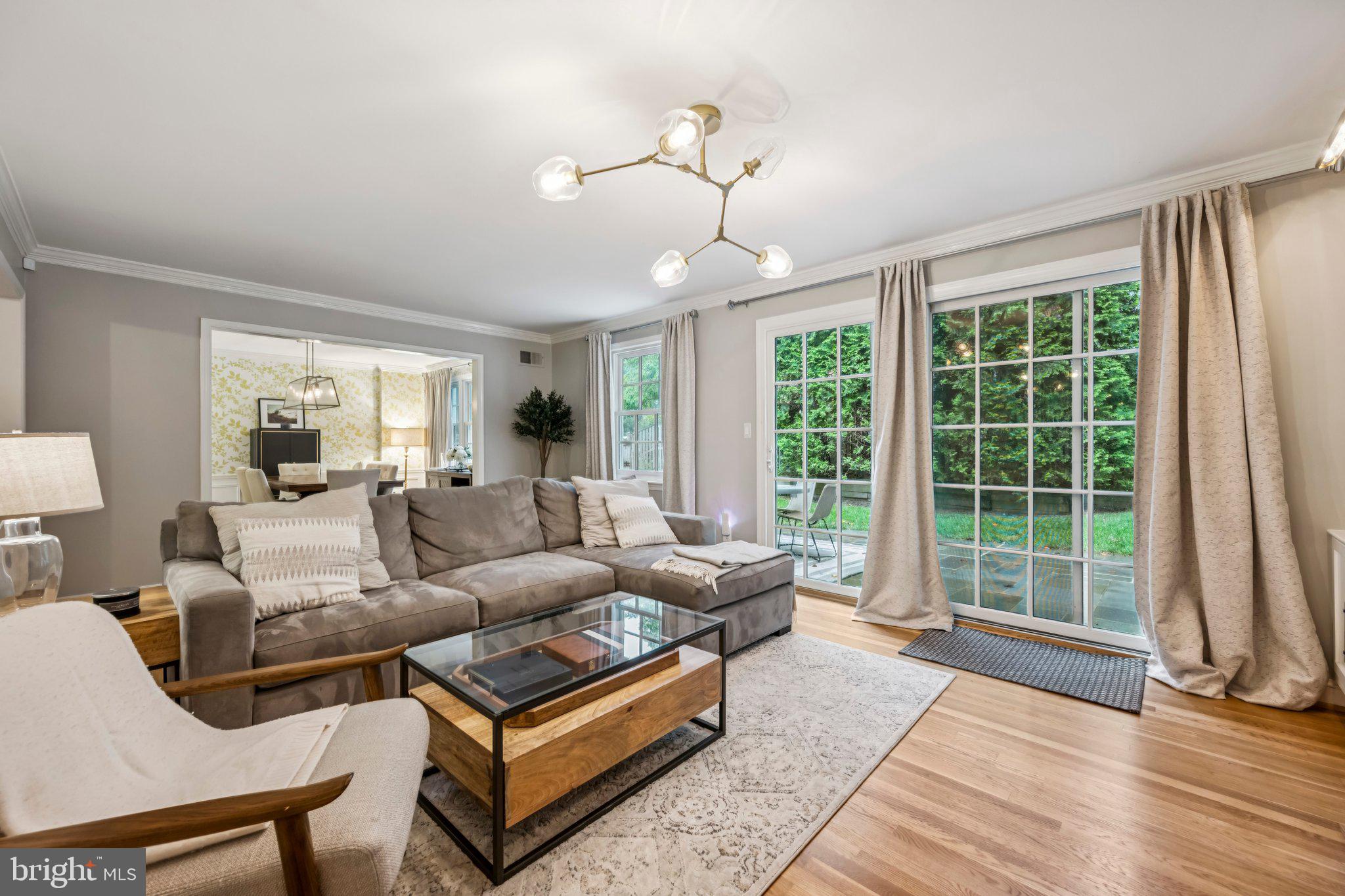 5109 River Hill Road Bethesda, MD 20816 - Photo 7 of 21 a living room with furniture and a large window