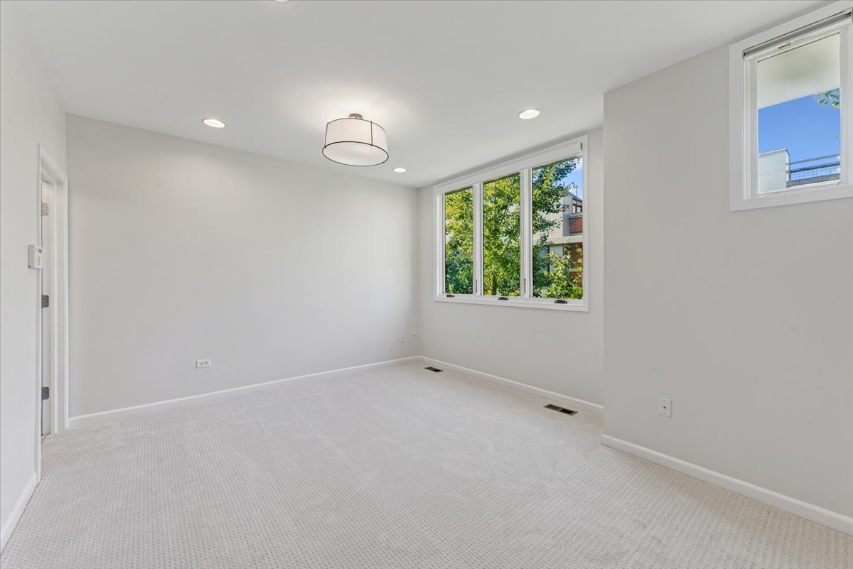 2225 West Madison Street, Unit 7 Chicago, IL 60612 - Photo 13 of 32 an empty room with windows