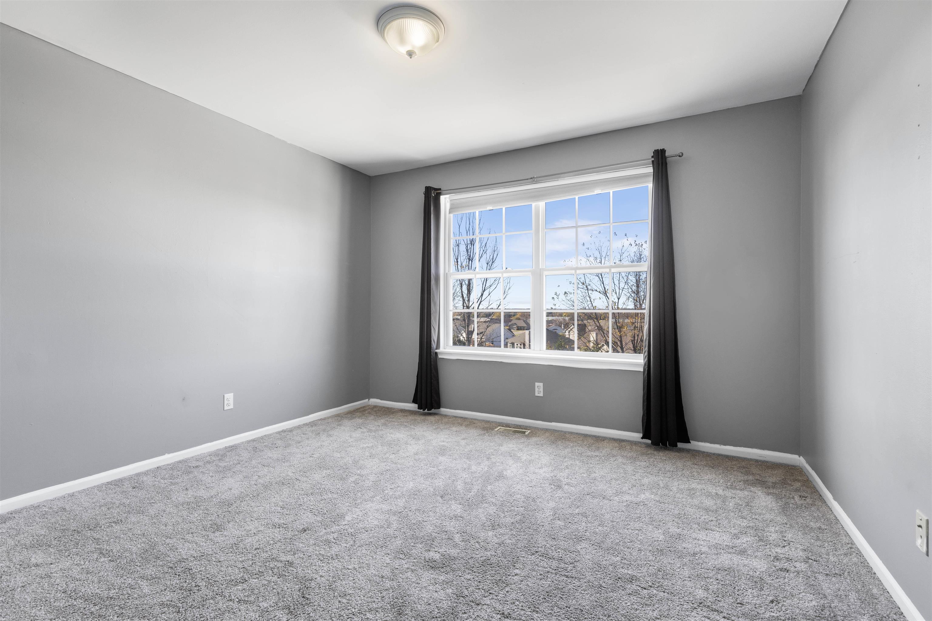 9360 Corriedale Run Roscoe, IL 61073 - Photo 23 of 34 a view of an empty room with a window