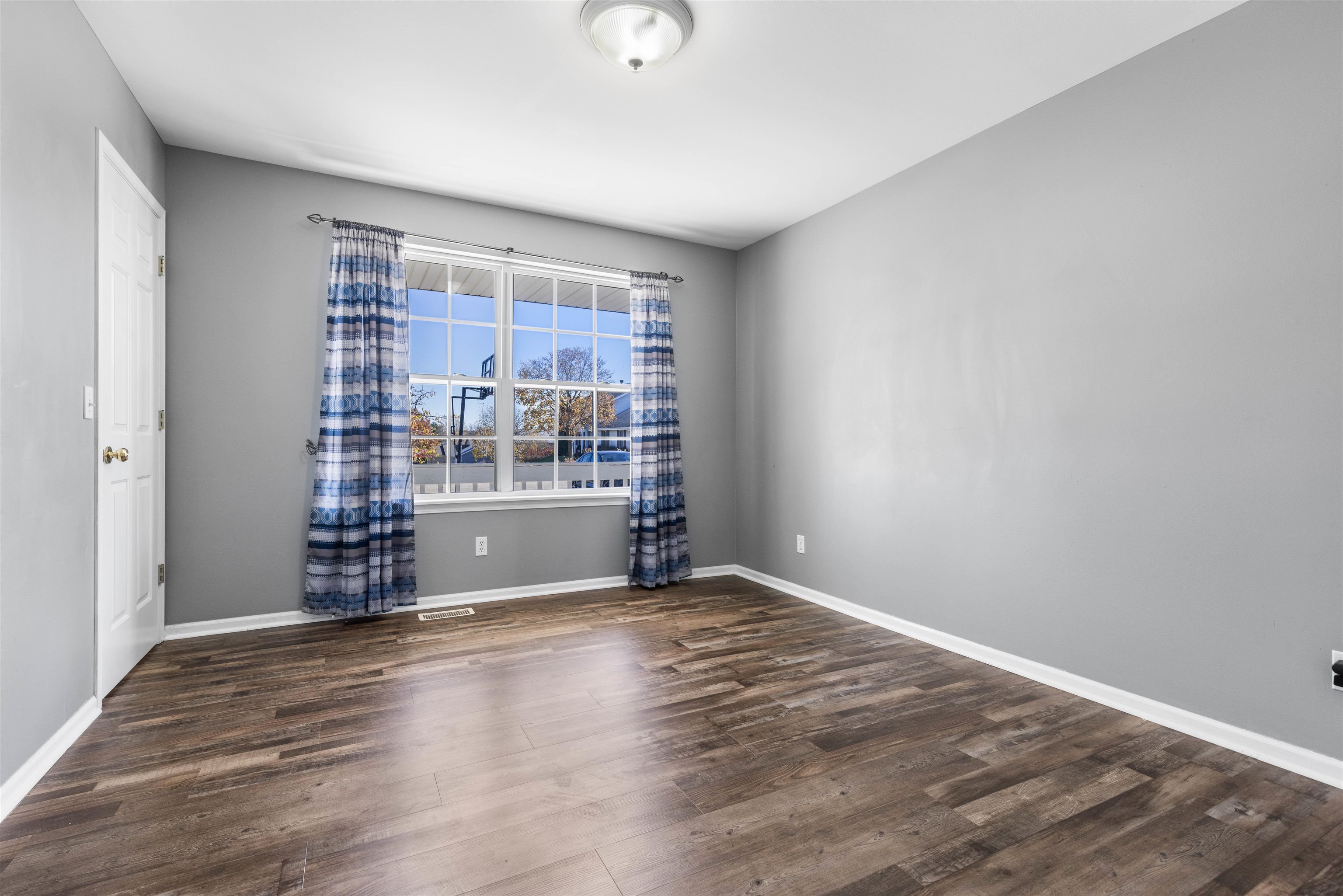 9360 Corriedale Run Roscoe, IL 61073 - Photo 7 of 34 a view of wooden floor and windows in a room