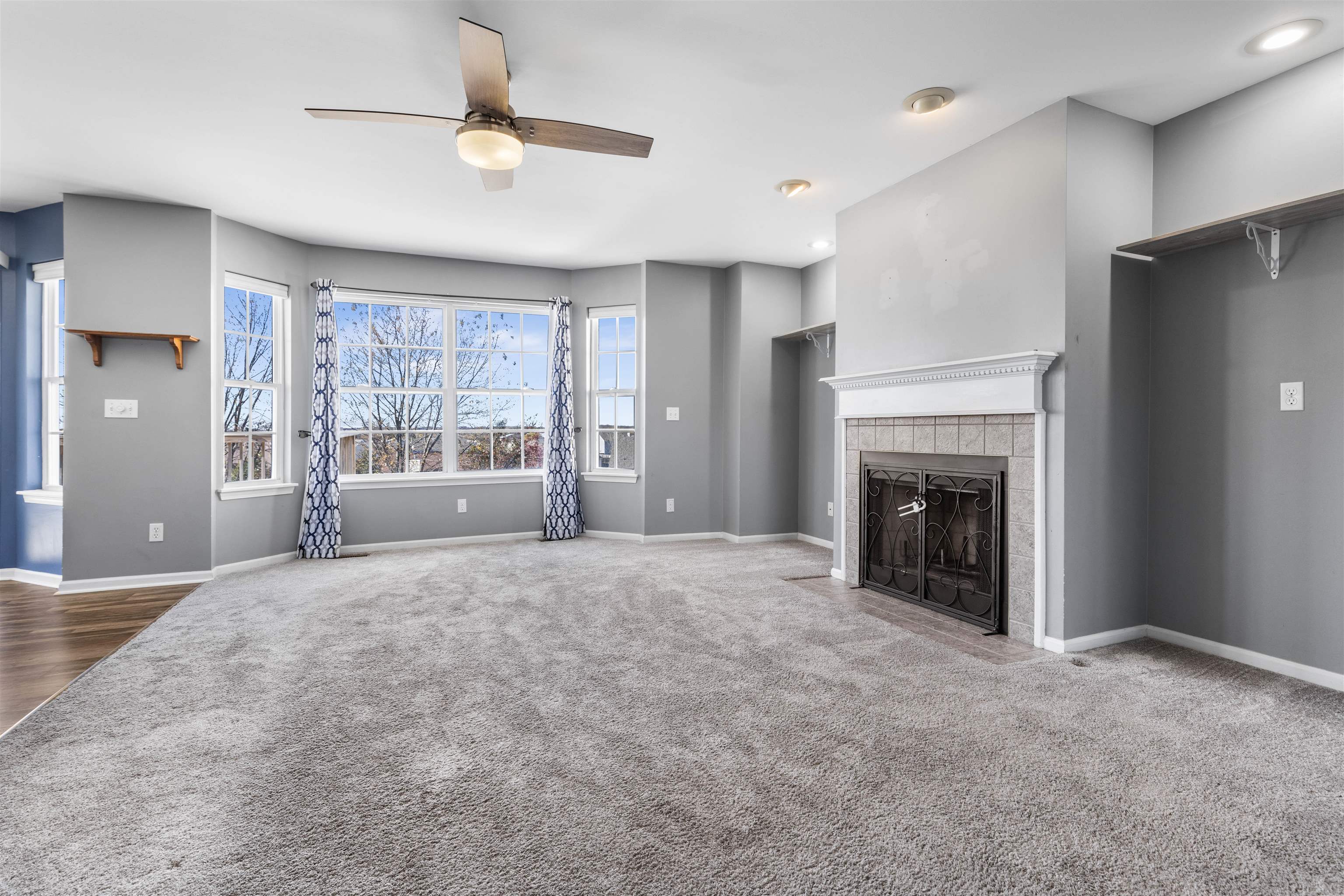 9360 Corriedale Run Roscoe, IL 61073 - Photo 9 of 34 a big room with windows and fireplace