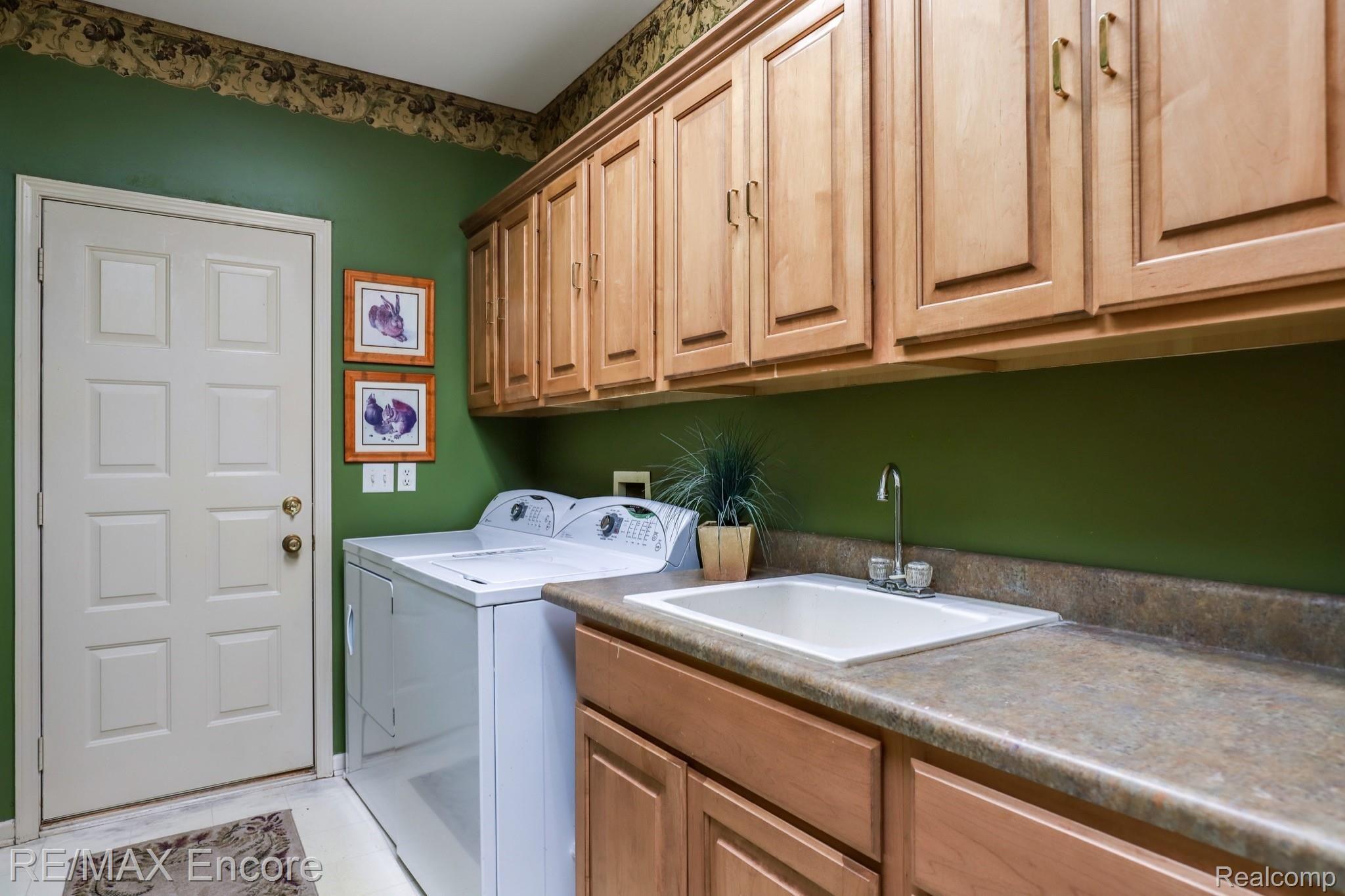 6807 Oakhurst Ridge Road Clarkston, MI 48348 - Photo 25 of 32 Expanded Laundry Room