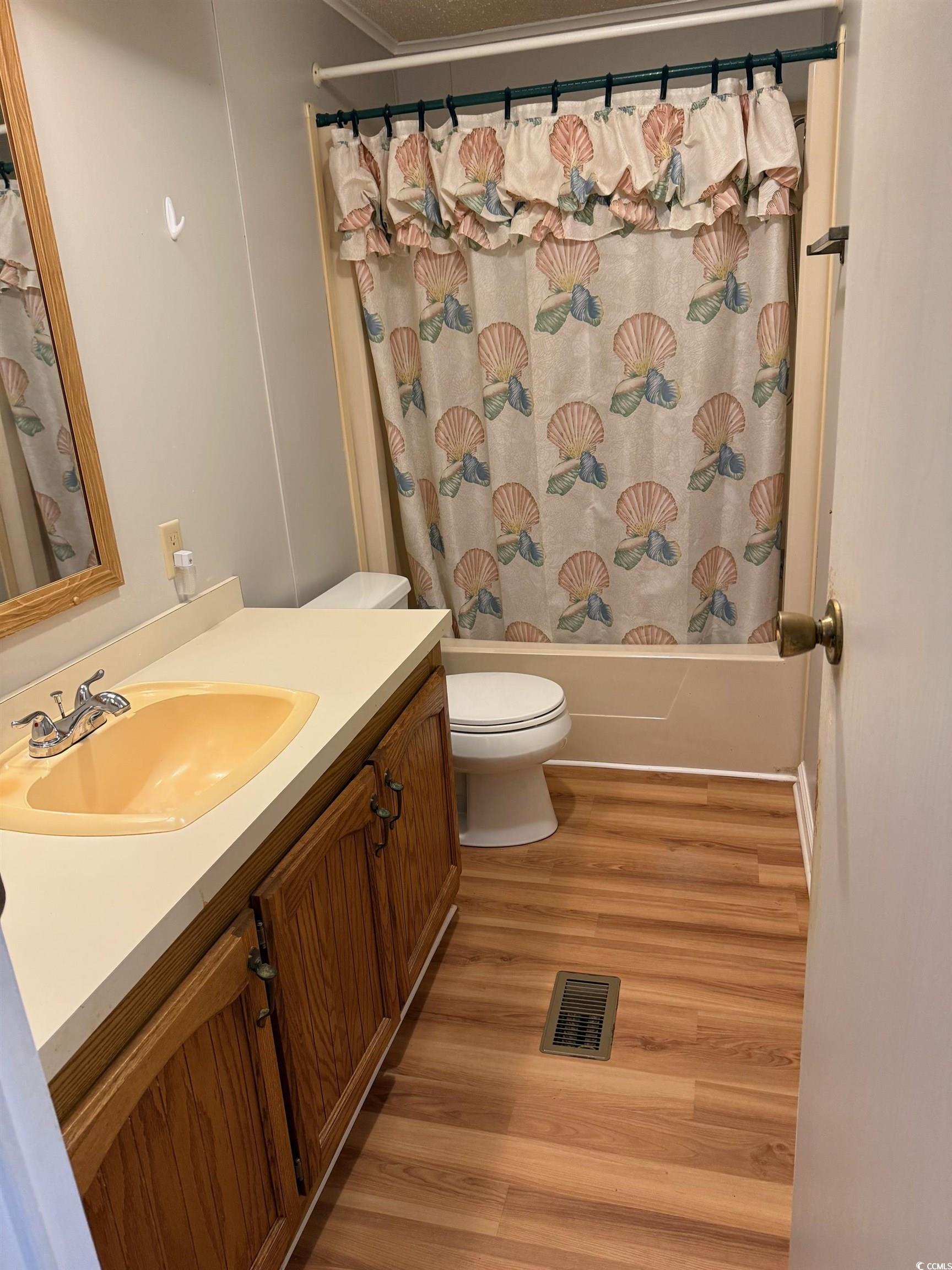 159 Crooked Island Circle Murrells Inlet, SC 29576 - Photo 12 of 20 Bathroom with vanity, shower / bath combination with curtain, and light wood finished floors
