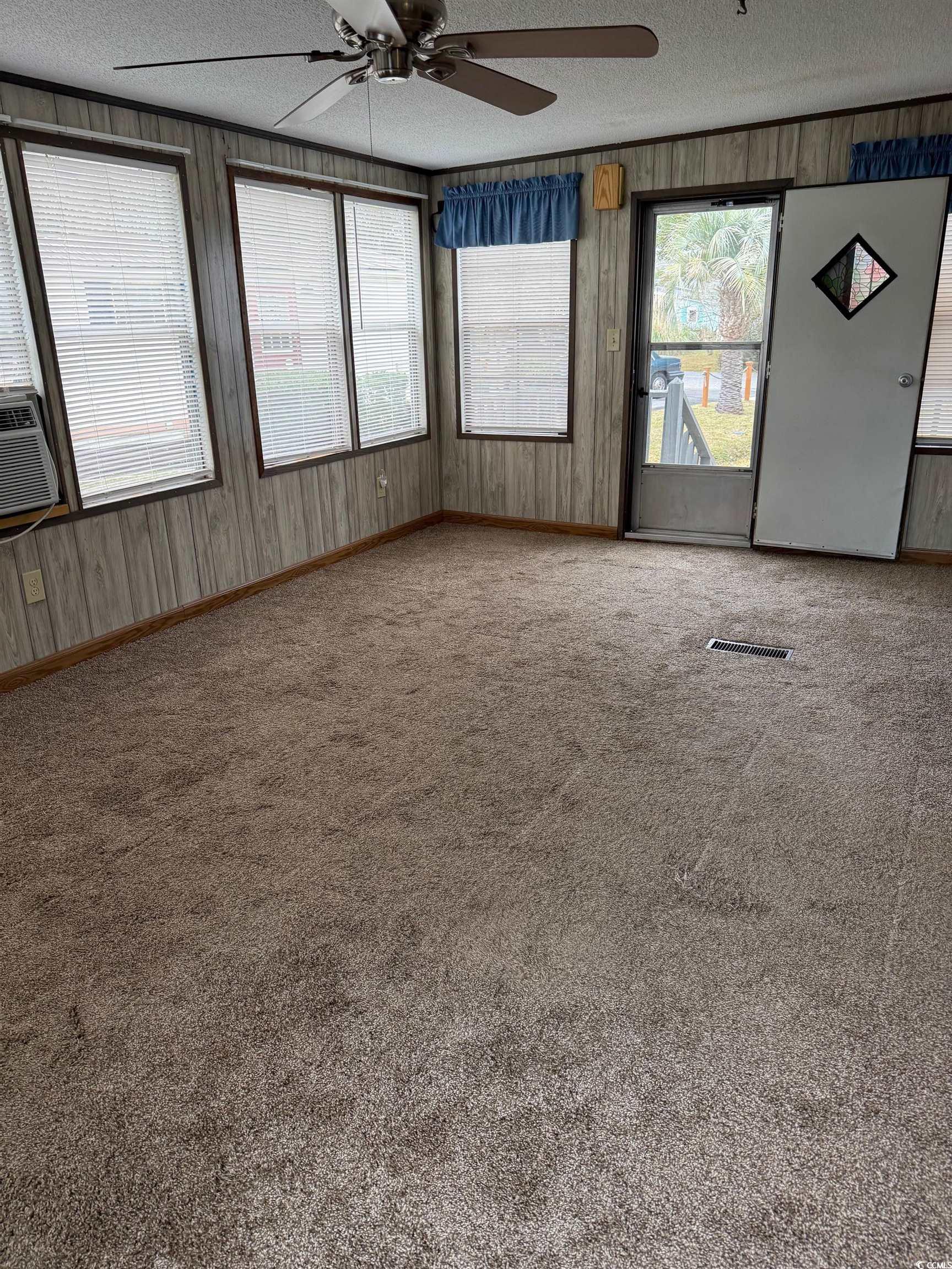159 Crooked Island Circle Murrells Inlet, SC 29576 - Photo 19 of 20 Unfurnished room featuring ceiling fan, a textured ceiling, and carpet