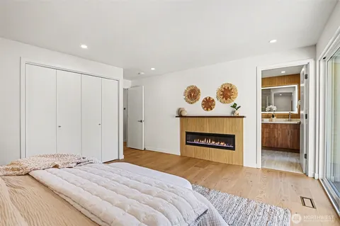 a bedroom with a bed and a lamp