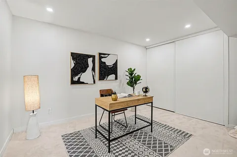 an aerial view of a houses with a lake