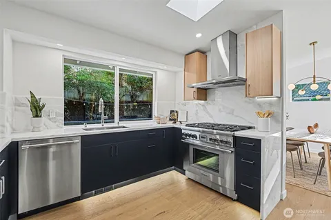 a view of a patio with table and chairs and potted plants