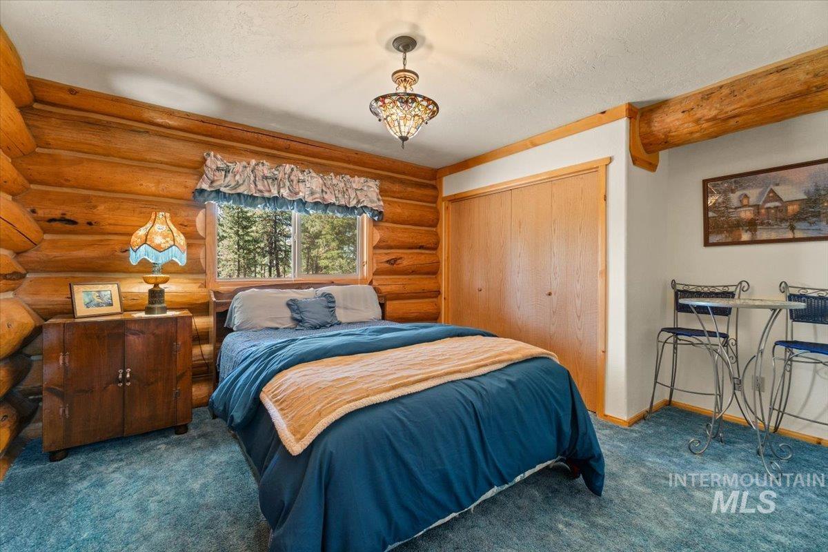 3725 Rim Road New Meadows, ID 83654 - Photo 21 of 50 Carpeted bedroom featuring a closet and a textured ceiling