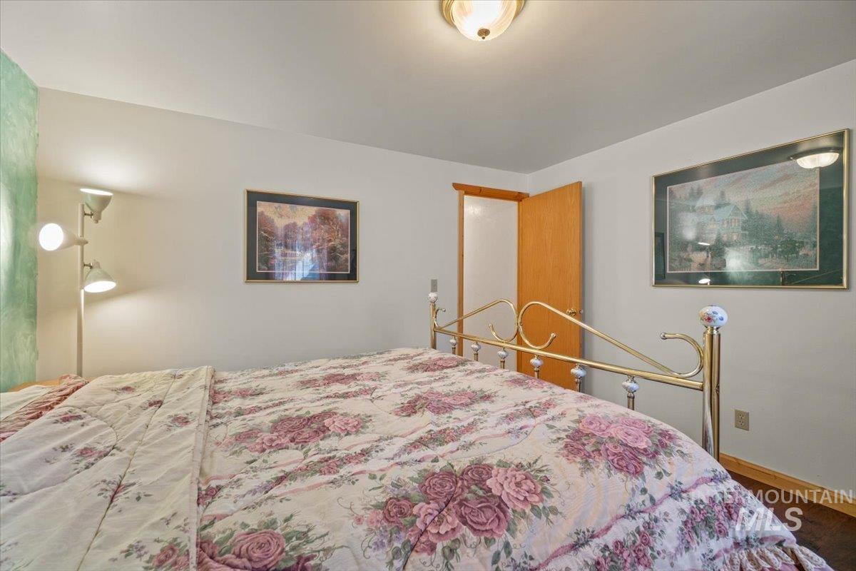 3725 Rim Road New Meadows, ID 83654 - Photo 38 of 50 Bedroom featuring baseboards and wood finished floors