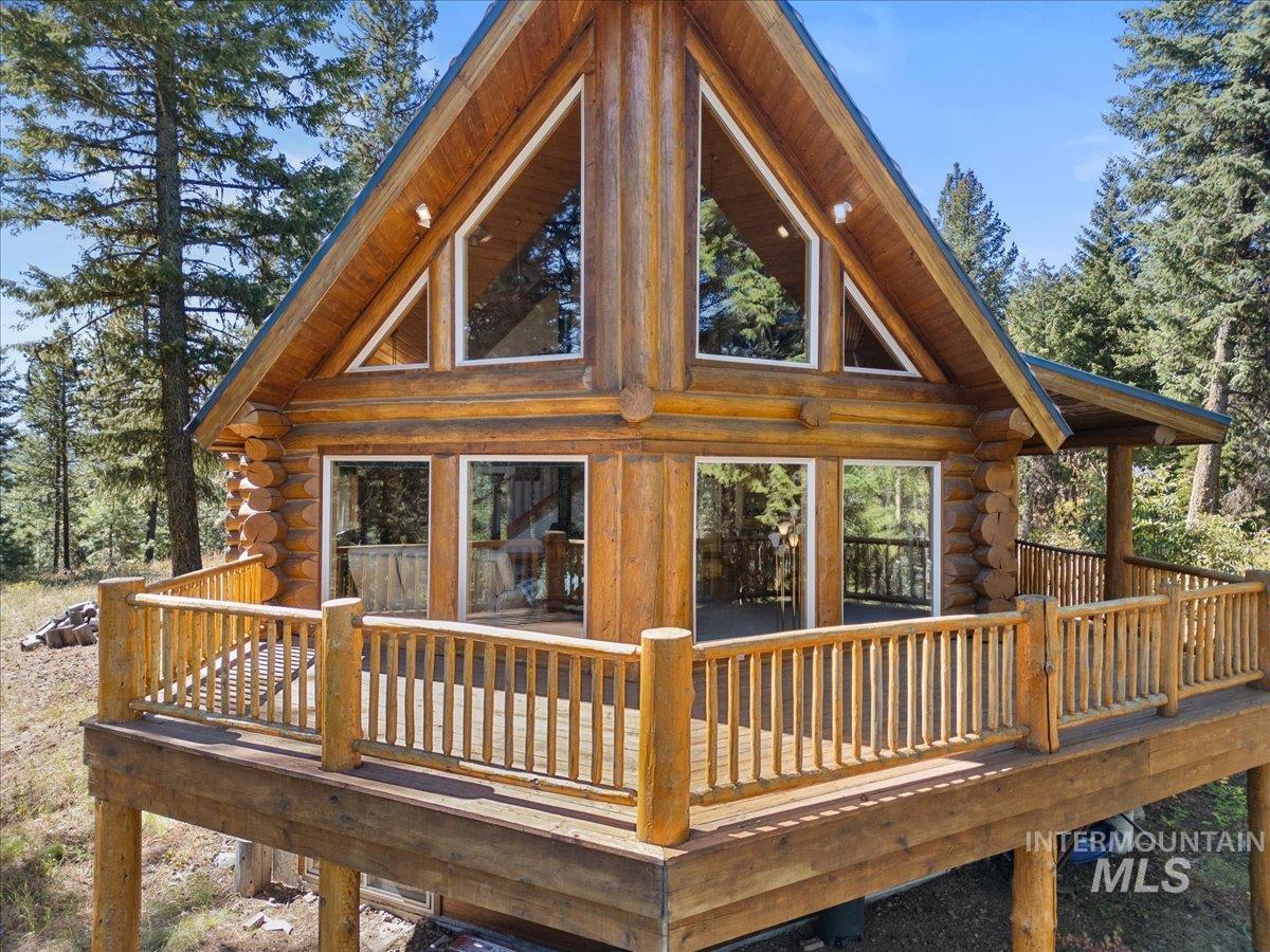 3725 Rim Road New Meadows, ID 83654 - Photo 44 of 50 Rear view of property with log siding and a deck