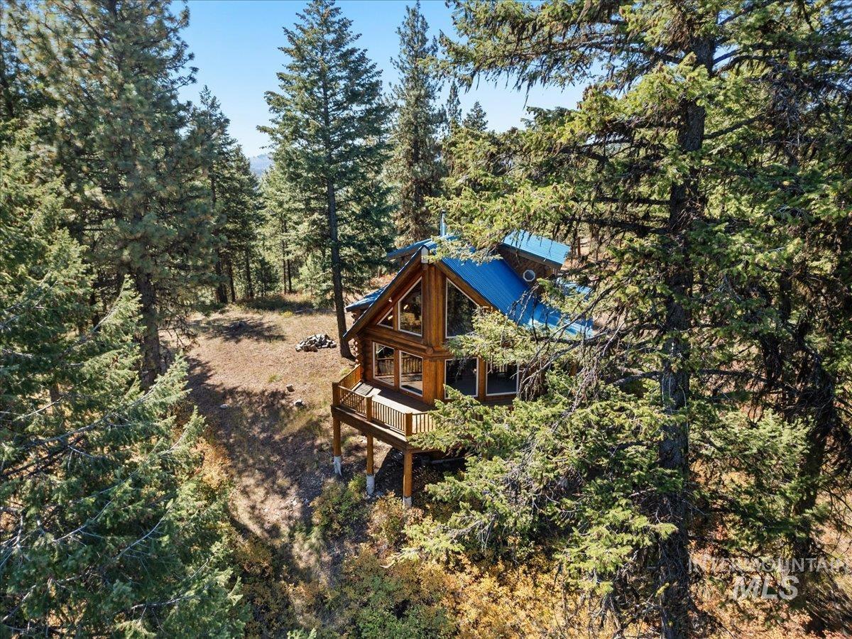3725 Rim Road New Meadows, ID 83654 - Photo 45 of 50 Rear view of property with a wooded view