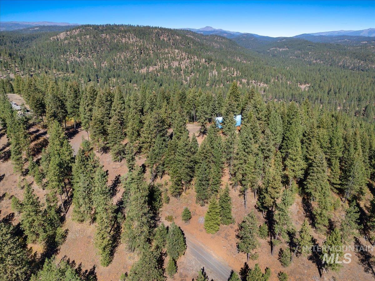 3725 Rim Road New Meadows, ID 83654 - Photo 48 of 50 Aerial view of property and surrounding area featuring mountains