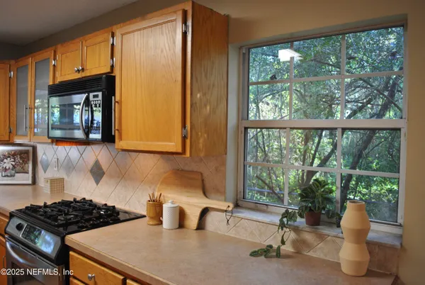 a kitchen with a sink and a window