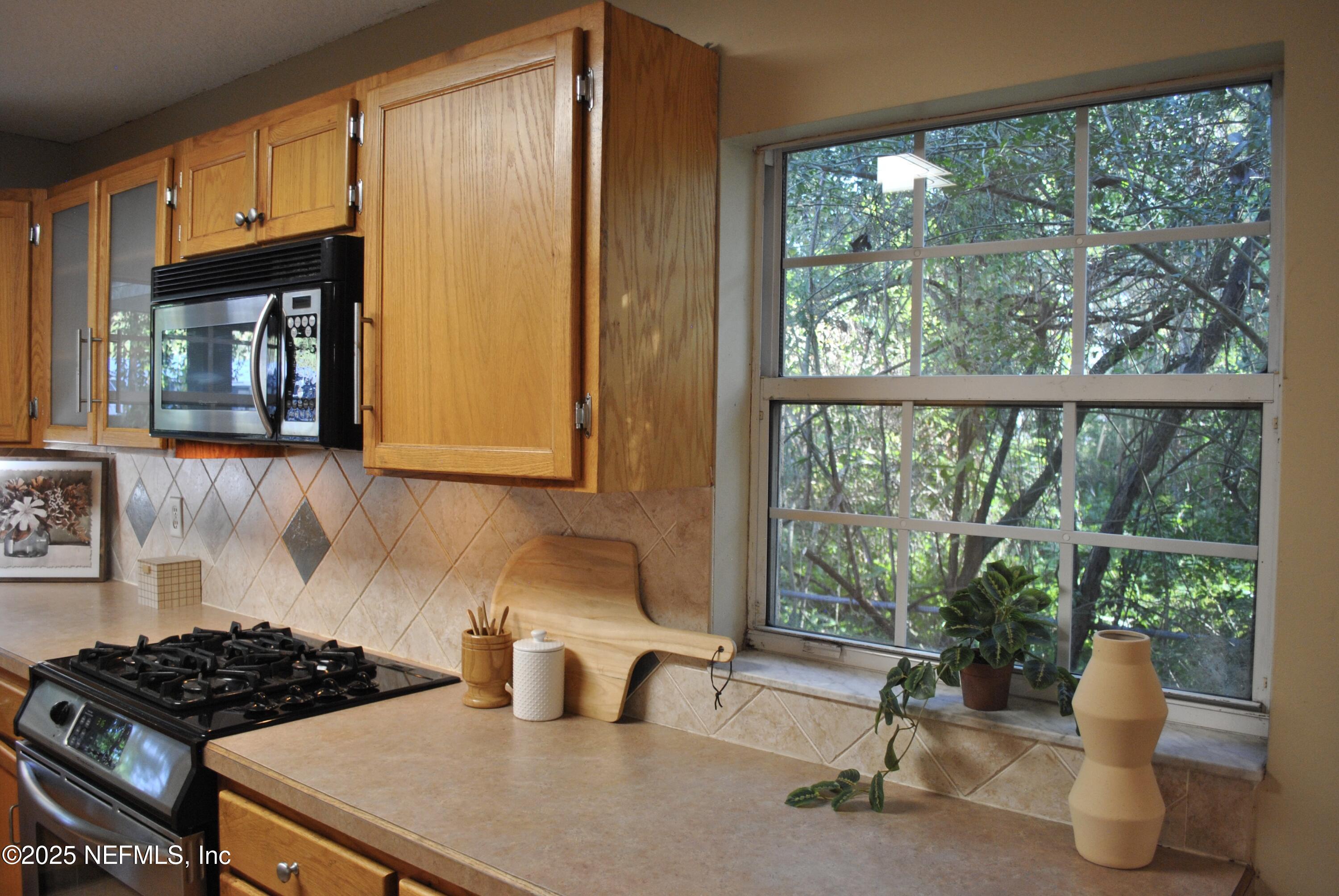 2819 North 6th Street St. Augustine, FL 32084 - Photo 5 of 18 a kitchen with a sink and a window