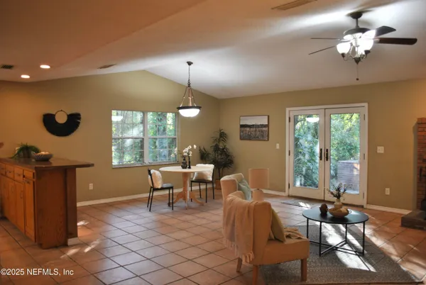a kitchen with a refrigerator and cabinets
