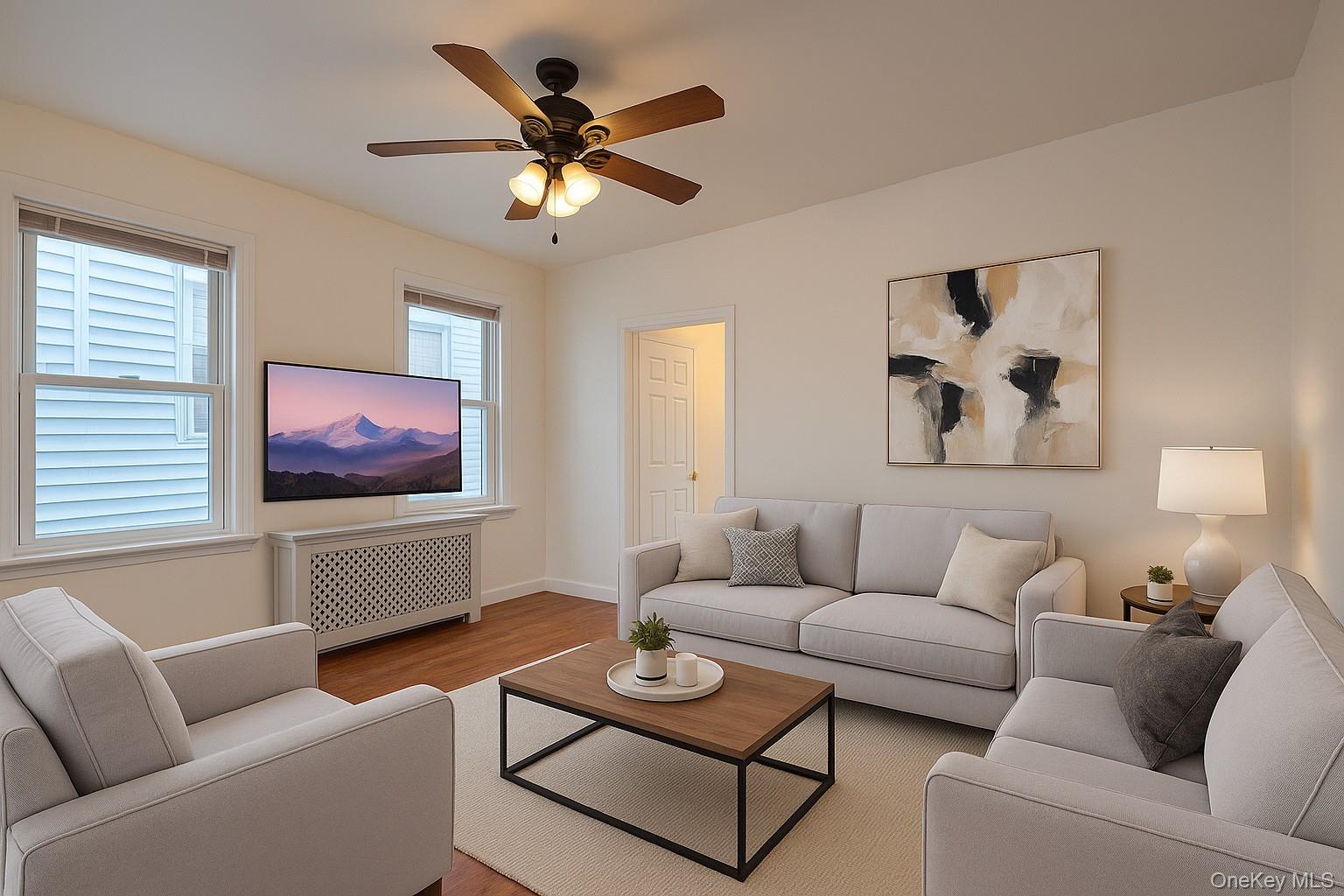 a living room with furniture and a flat screen tv
