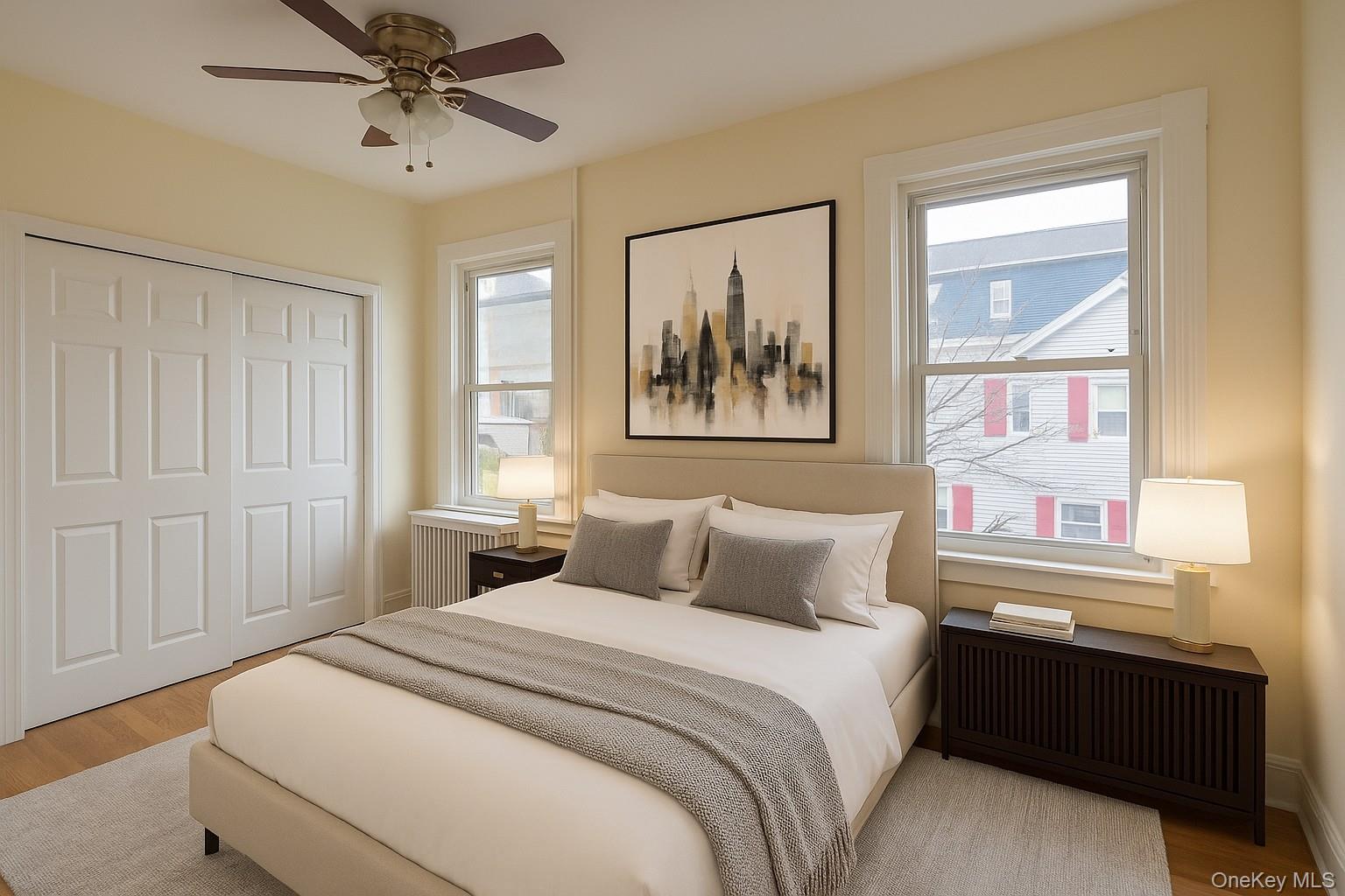 104 Livingston Avenue, Unit 2 Yonkers, NY 10705 - Photo 11 of 12 a bedroom with a bed and a painting on the wall