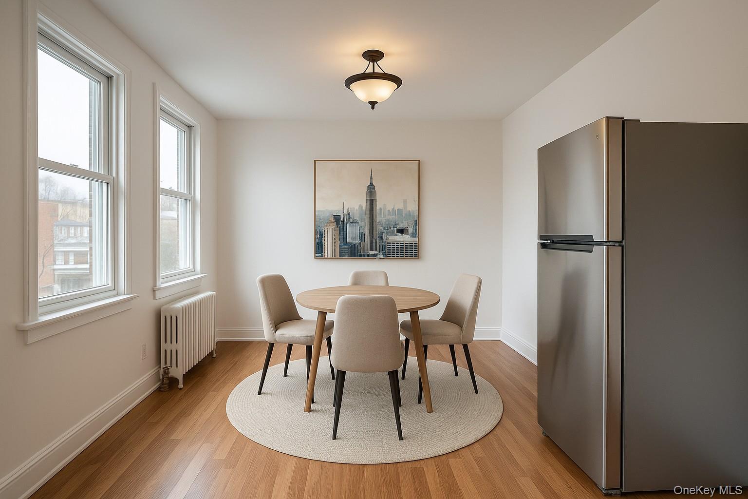 104 Livingston Avenue, Unit 2 Yonkers, NY 10705 - Photo 7 of 12 a dining room with furniture a window and wooden floor