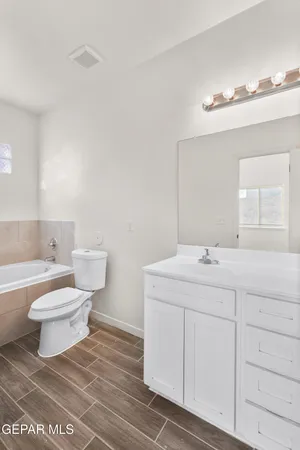 a bathroom with a bathtub and window